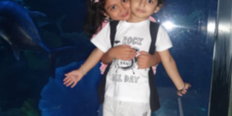 A cute picture of kids posing at the Dubai Aquarium