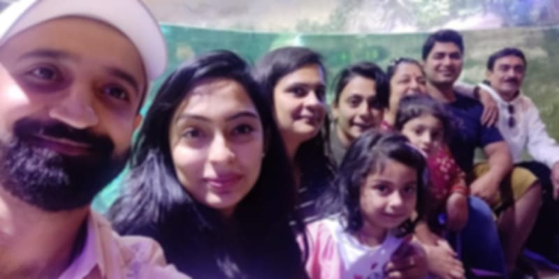 A group of people who went on a family trip to Dubai posing for a picture