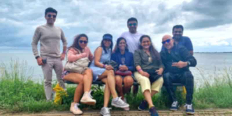 A picture of a group of 8 friends, that was taken in Europe