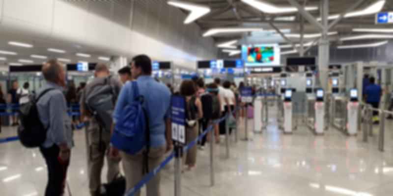 A group of people waiting for immigration check