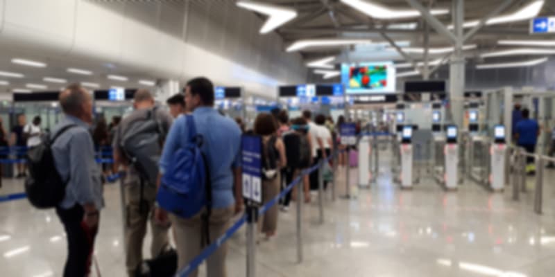 A group of people waiting for immigration check