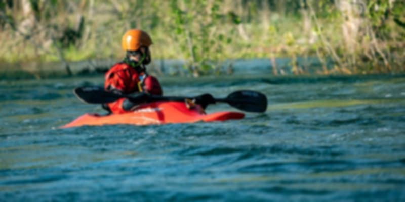 a man kayaking on a river