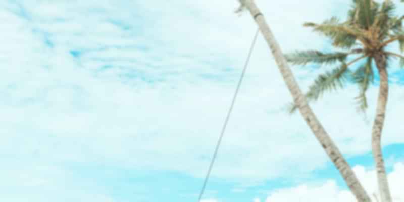 a girl swinging on the beach.