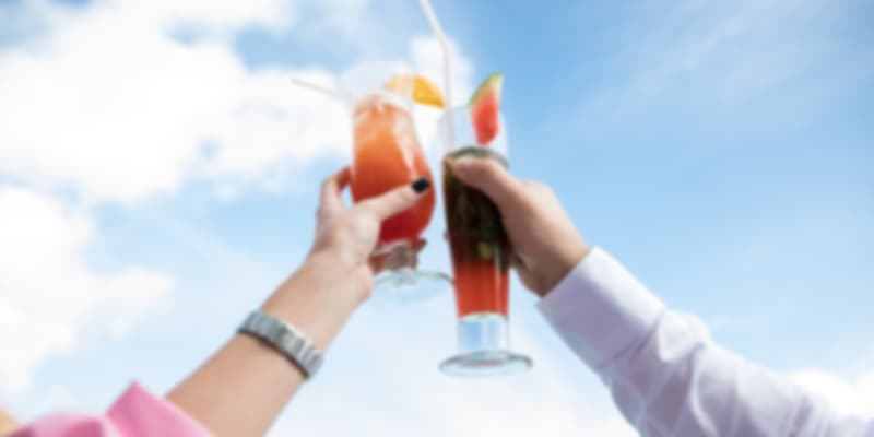 Couple holding glasses