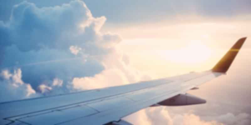 plane-wing-flight-sky-clouds-How to Reach Austria from India