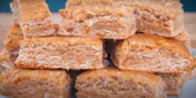 Traditional Basler Läckerli stacked neatly, made with honey, almonds, and spices—a festive Swiss Christmas biscuit from Basel.
