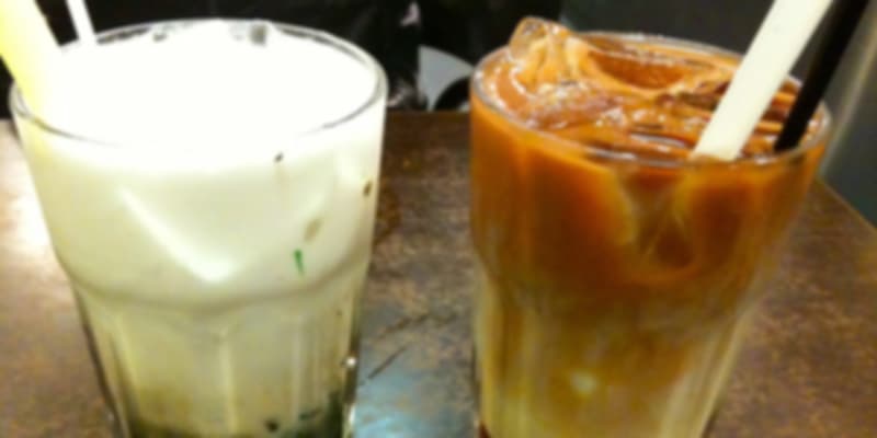 Traditional Singaporean chendol drink with coconut milk, gula melaka, and green jelly served with ice.