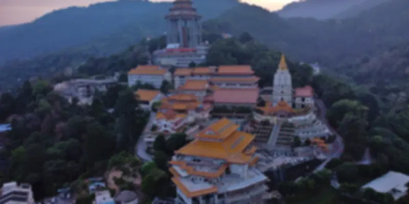 Kek Lok Si Temple in Penang, Malaysia, featuring golden pagodas and hilltop views over Air Itam