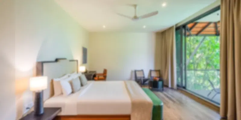 Peaceful room at Anantara Eastern Mangroves Abu Dhabi overlooking lush mangroves and natural surroundings.