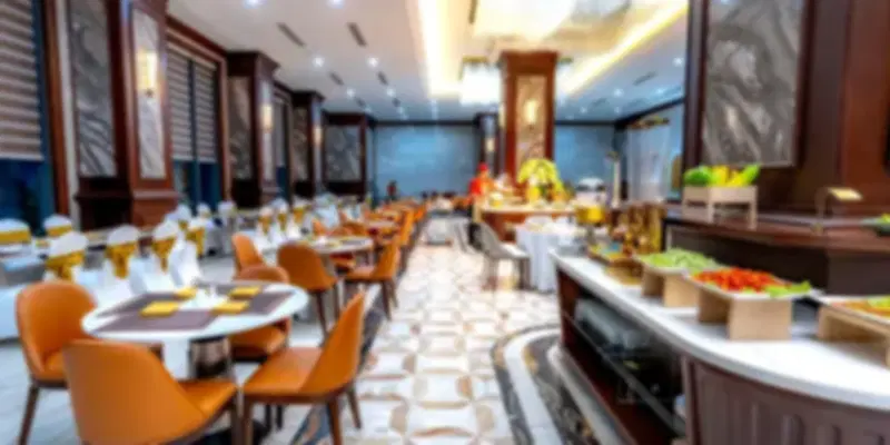 Elegant dining hall of Martabaan by Hemant Oberoi, one of the finest Indian restaurants in Abu Dhabi, featuring luxurious interiors, comfortable seating, and a premium buffet setup.
