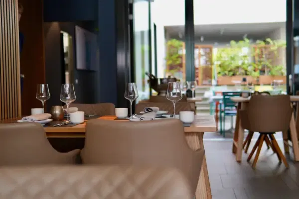Elegant dining area at Moksh, one of the leading Michelin-starred Indian restaurants in Abu Dhabi, featuring contemporary interiors and a sophisticated fine-dining ambience.