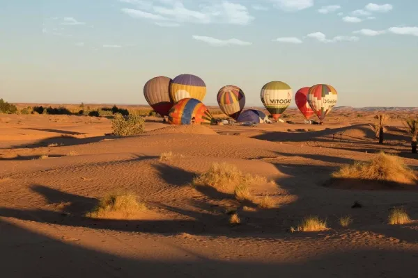 Hot air balloon flights in Dubai preparing for sunrise over the golden Arabian Desert