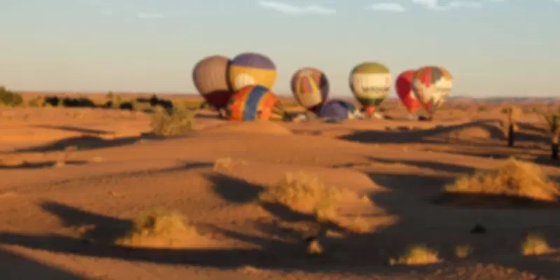 Hot air balloon flights in Dubai preparing for sunrise over the golden Arabian Desert
